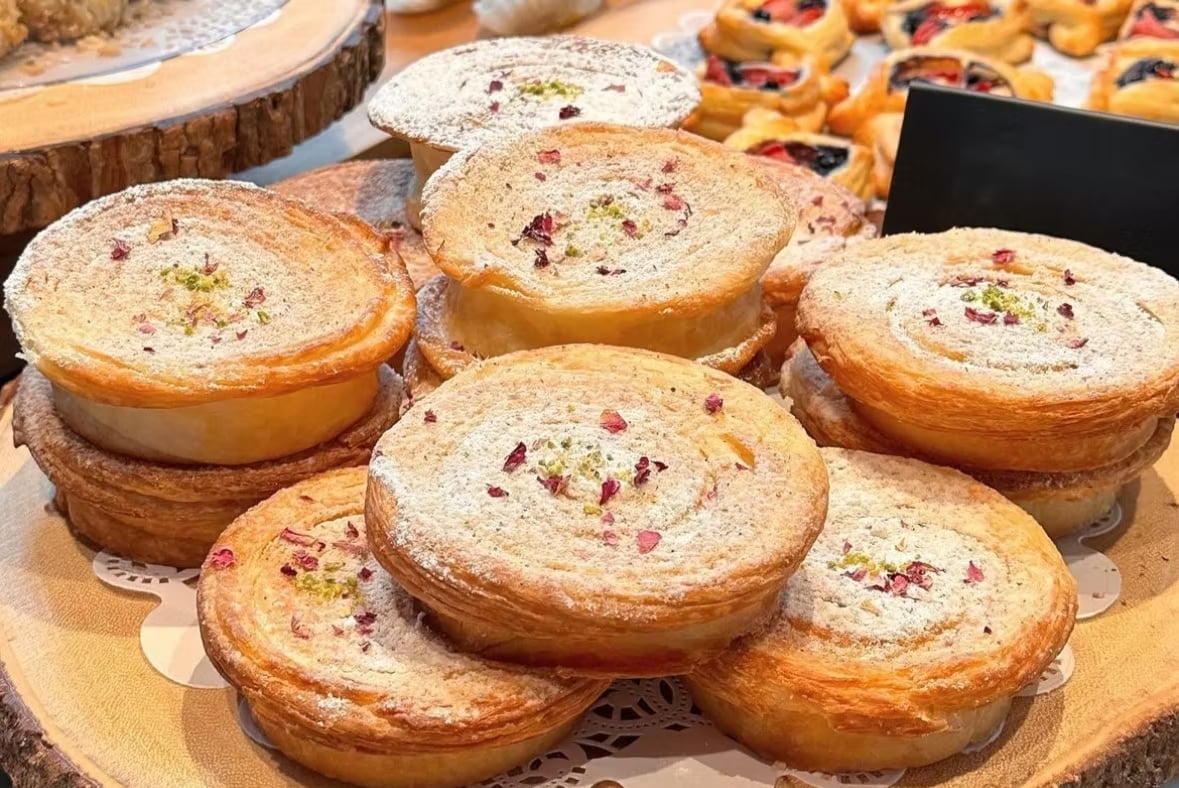 Bahar Bakery — pastry case, warm lighting, fresh bread