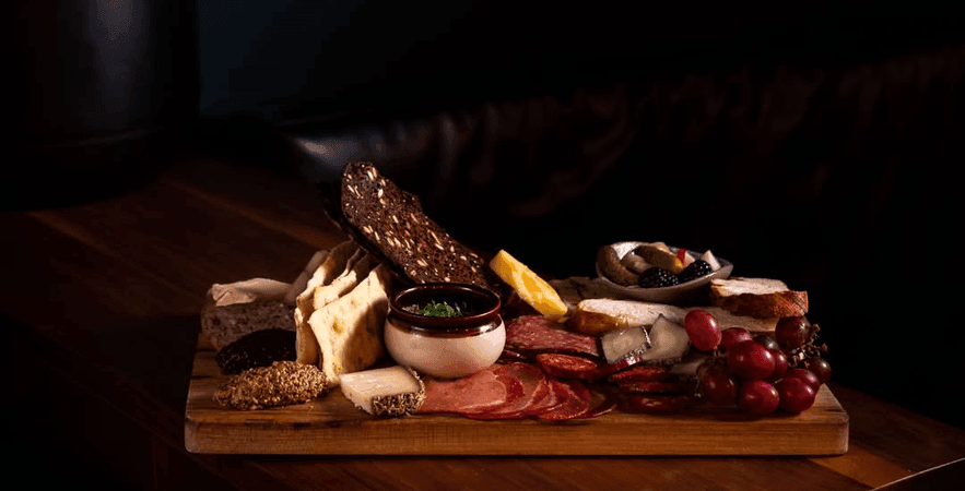 Bartholomew — tiny bar, charcuterie board, candlelight