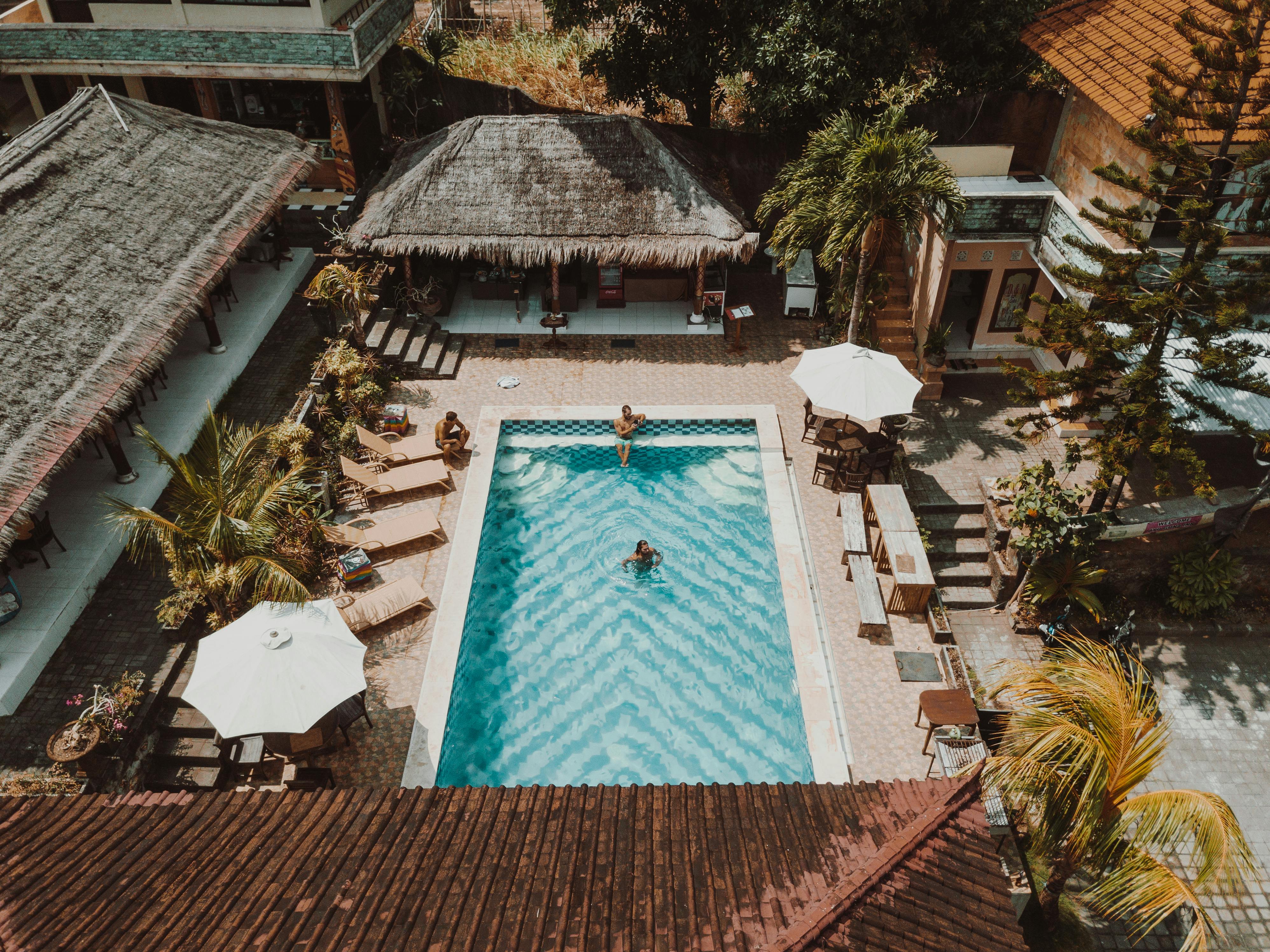 Courtyard — the pool at midday, guests at leisure